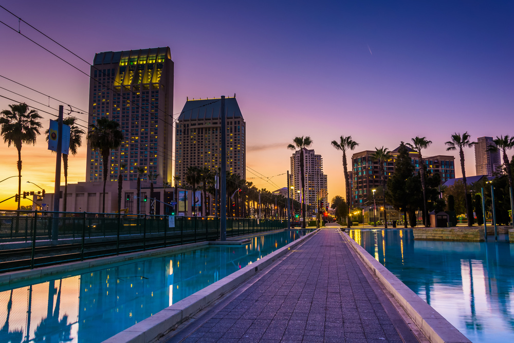 Skyscrapers and the Childrens Pond at sunset, in San Diego, California.